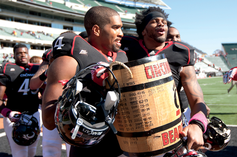 Orion Woodard and Ben Pooler carry the Keg of Nails trophy