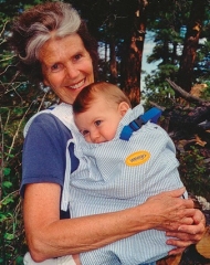 Ann Moore carrying a baby in a Snugli