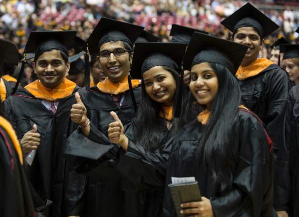 UC students gestures thumbs-up during the Doctoral Hooding & Master's Recognition Ceremony Friday May 1, 2015 at Fifth Third Arena. UC/Joseph Fuqua II 