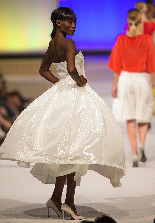 An African-American woman models a swinging dress at the University of Cincinnati Fashion Show in May 2015.
