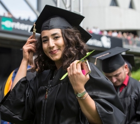  A graduate turns the tassel on her cap