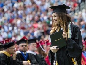  A grad holds her degree 