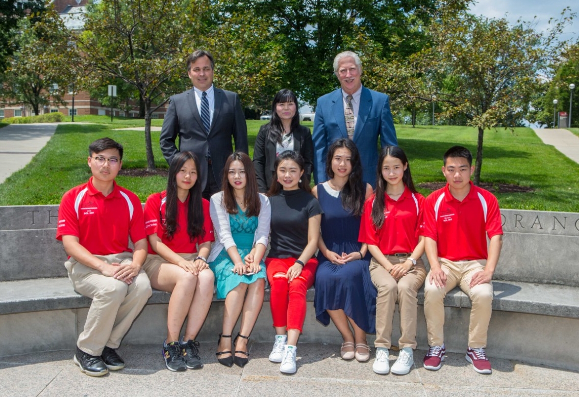 UC will celebrate the graduation of 56 engineering students in a partnership with Chongqing University. Pictured are UC College of Engineering and Applied Science Interim Dean Paul Orkwis, left, program coordinator Xiaoqun “Sherry” Liao and Associate Dean of Undergraduate Affairs Arthur Allen. Seated from left are students Jinglun Yu, Yuelin Fan, Yixuan Zhang, Zijia Shen, Jingyi Zhu, Lingchi Li and Zhihao Sun. (Photo by Andrew Higley/UC Creative Services)