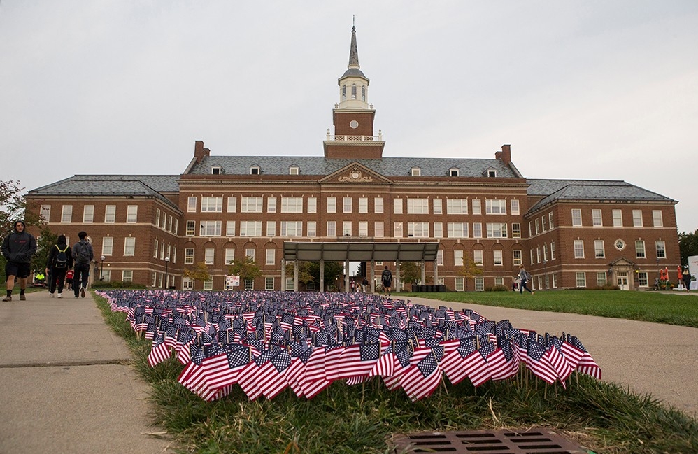More than 2,000 American flags are planted in the grass of McMicken Commons, one for each of the people killed by the terrorist attacks on Sept. 11, 2001.
