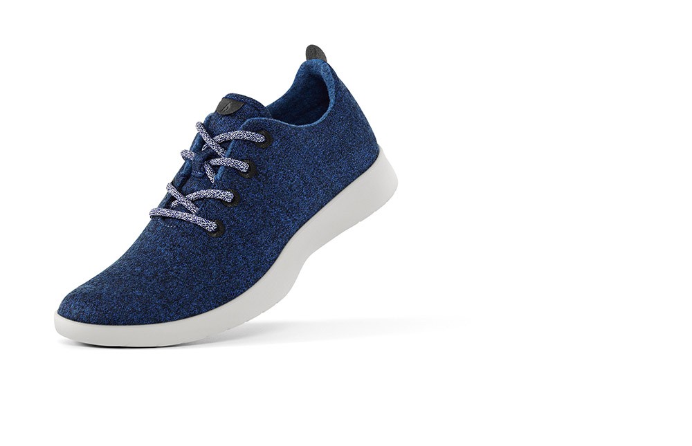 A product image of Allbirds' wool runner, a dark blue sneaker made of wool.