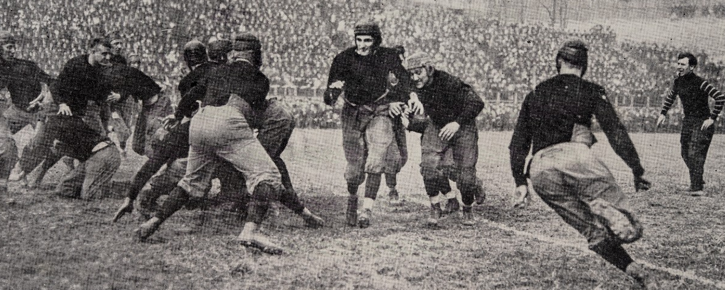   Leonard Teddy Baehr carries the ball at UC on Oct. 31, 1914.