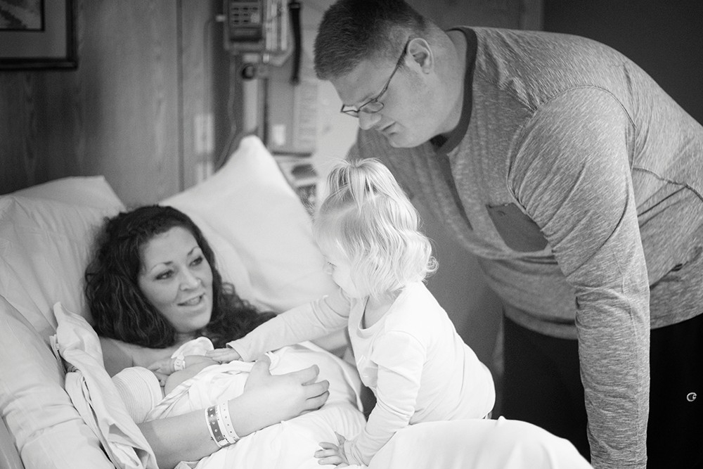  The Robinson family bonds with their new growing family in the hospital.
