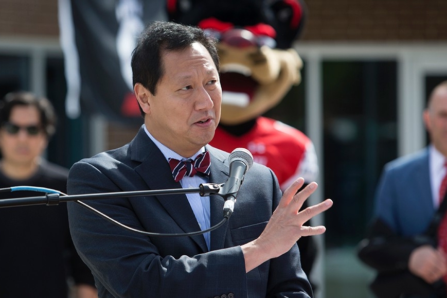 The University of Cincinnati President Santa Ono addresses the people gathered for the unveiling of a UC Bearcat statue.