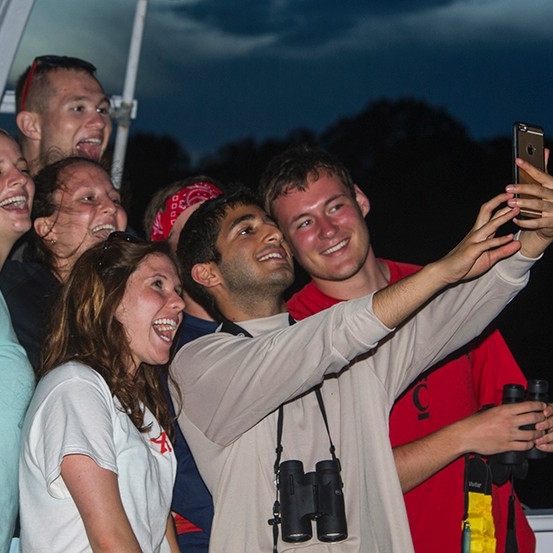  Students pose for a selfie while on the Amazon River.