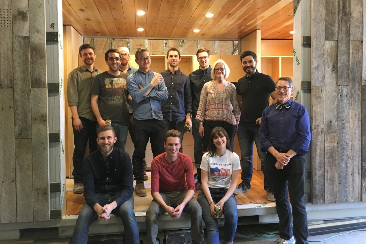 Students from the spring 2016 semester gather with Cassel and professors in the under-construction house. Left to right (front row): DAAP graduate students Jon Lund, Alex Gormley, Marissa Zane and structures professor Tom Bible. Left to right (back row): DAAP graduate students Tom Covert, Narek Mirzaei, studio professor Whitney Hamaker, Guande Wu, Alex Bucher, Dylan Holte, land steward Adrienne Cassel and Luis Sabater Musa. Photo/provided DAAP students and professors gather inside a tiny house (being stored in a workshop) with land steward Adrienne Cassel.