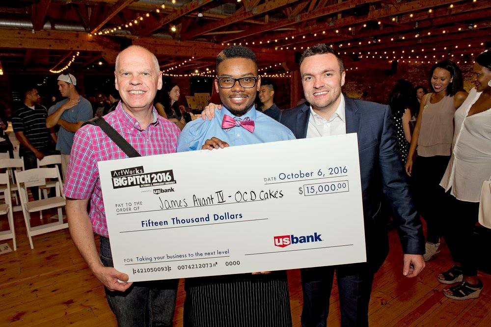 James Avant poses with mentors Paul Picton (left) and Michael Howard (right) with a giant check for $15,000 after winning the Big Pitch competition.