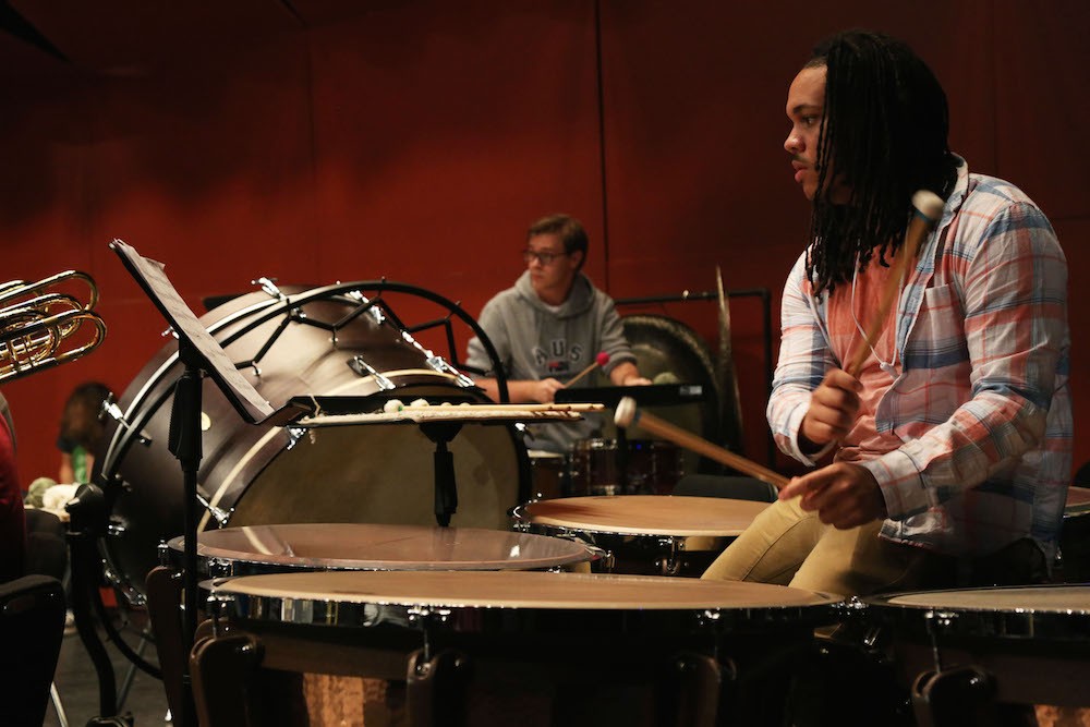 Student plays the timpani drums