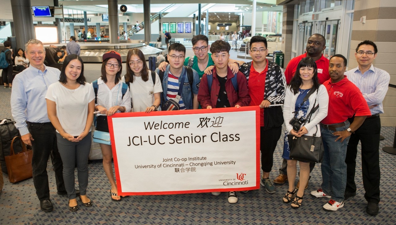 Staff in UC's Joint Co-op Institute greet students arriving from China. (Joseph Fuqua II/UC Creative Services)