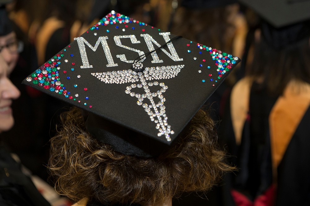 Grads show flair and personality by decorating their caps.