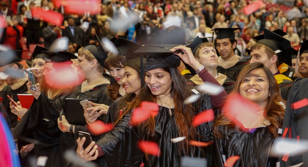 Graduates celebrate amid confetti at UC's fall 2016 Commencement