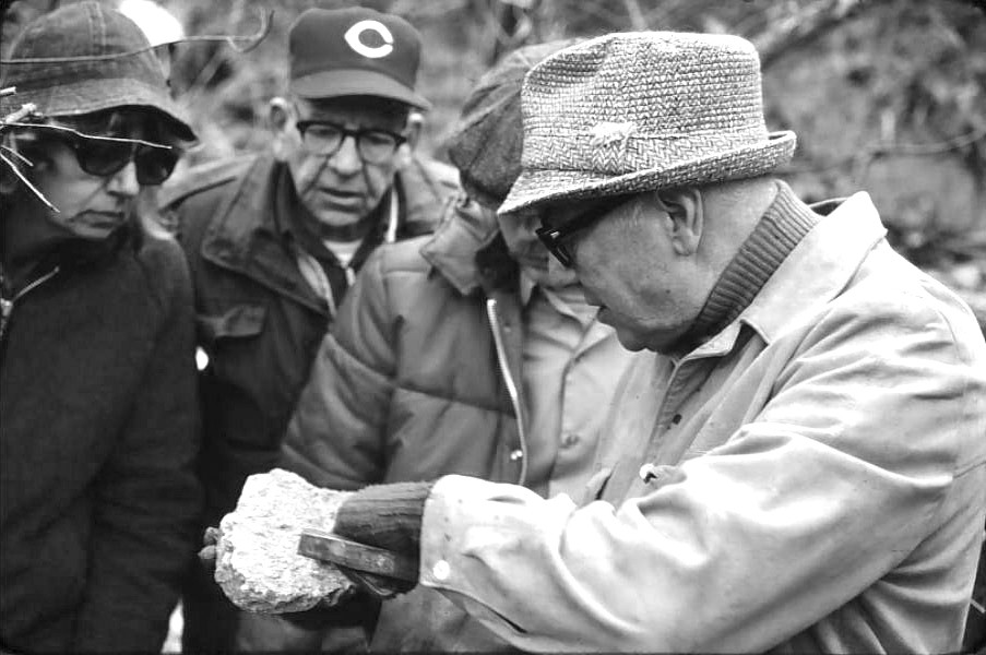 The late UC geology professor Kenneth Caster confers with other members of the Cincinnati Dry Dredgers over a find during a 1977 outing.