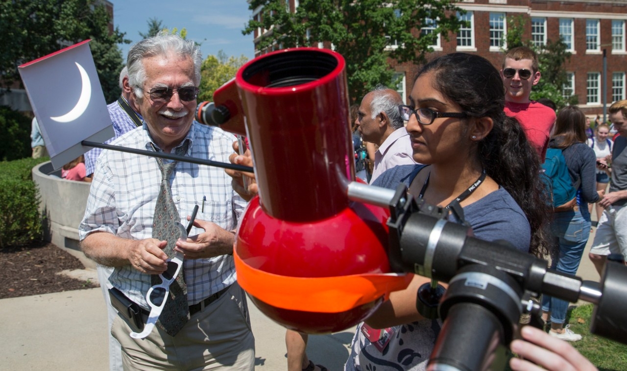 students observe solar eclipse