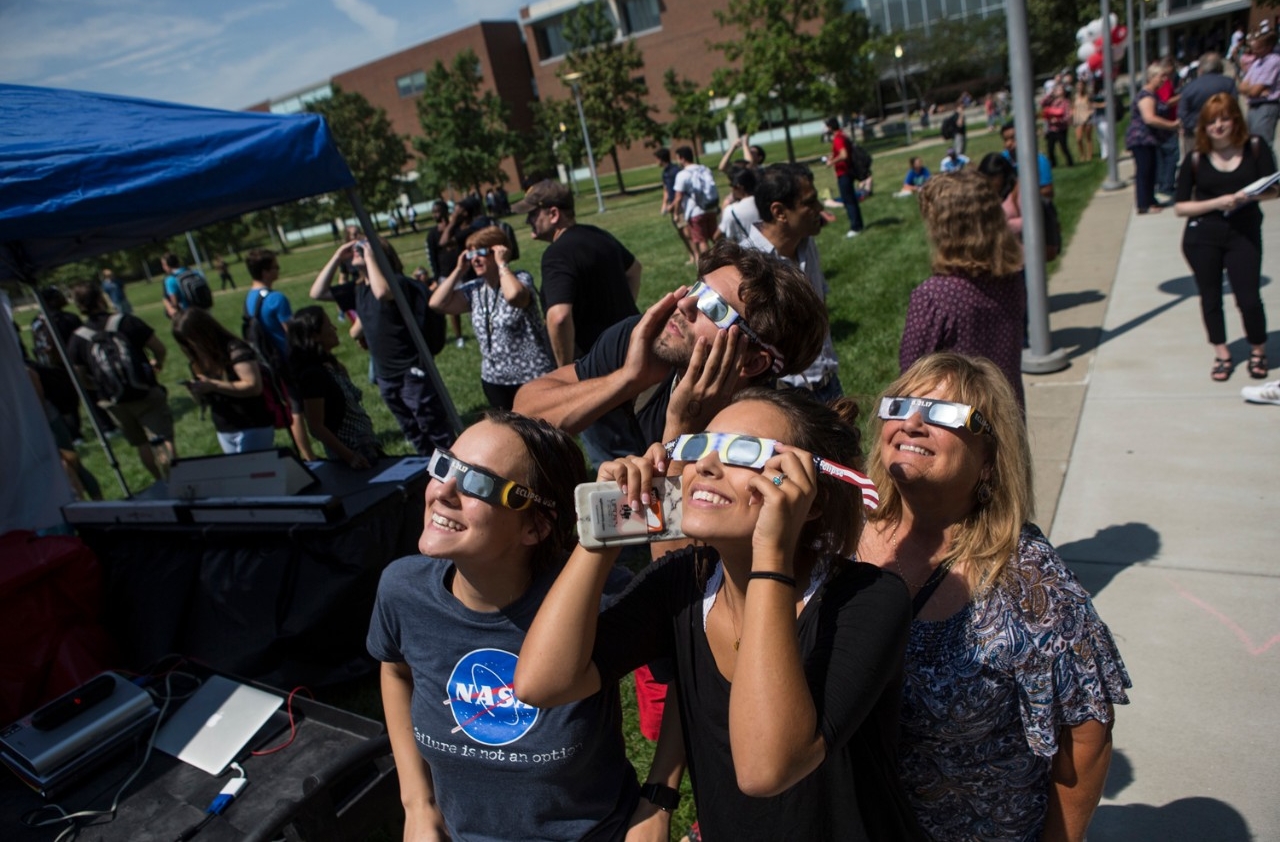 students observe solar eclipse