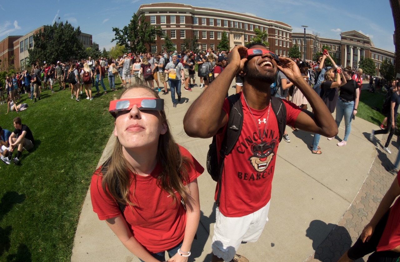 students observe solar eclipse