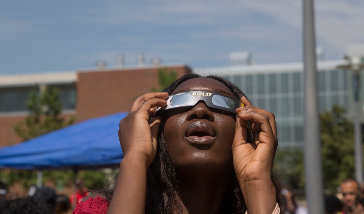 students observe solar eclipse