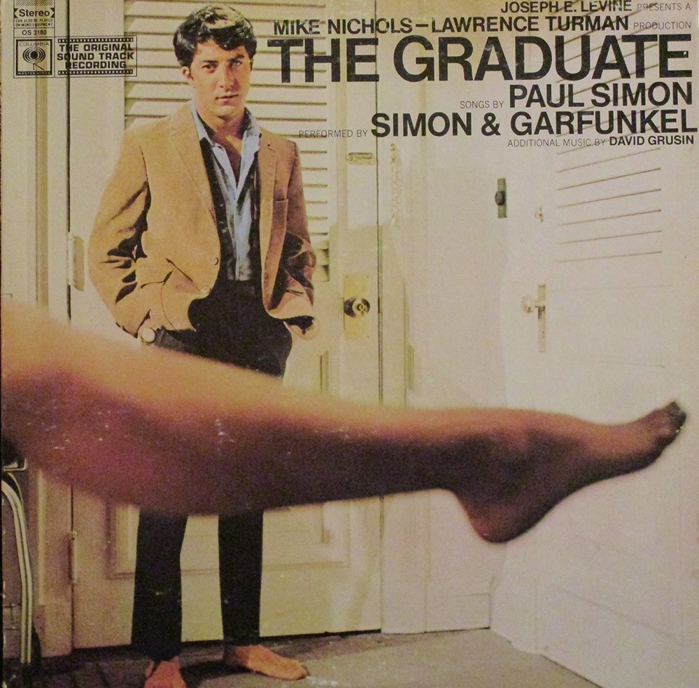 The album sleeve of the soundtrack to The Graduate with a young Dustin Hoffman and Anne Bancroft's leg in the foreground. 