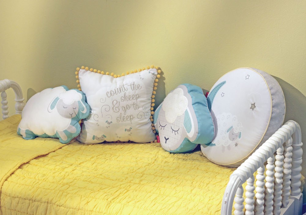 Blue, yellow and white sheep-themed children's pillows