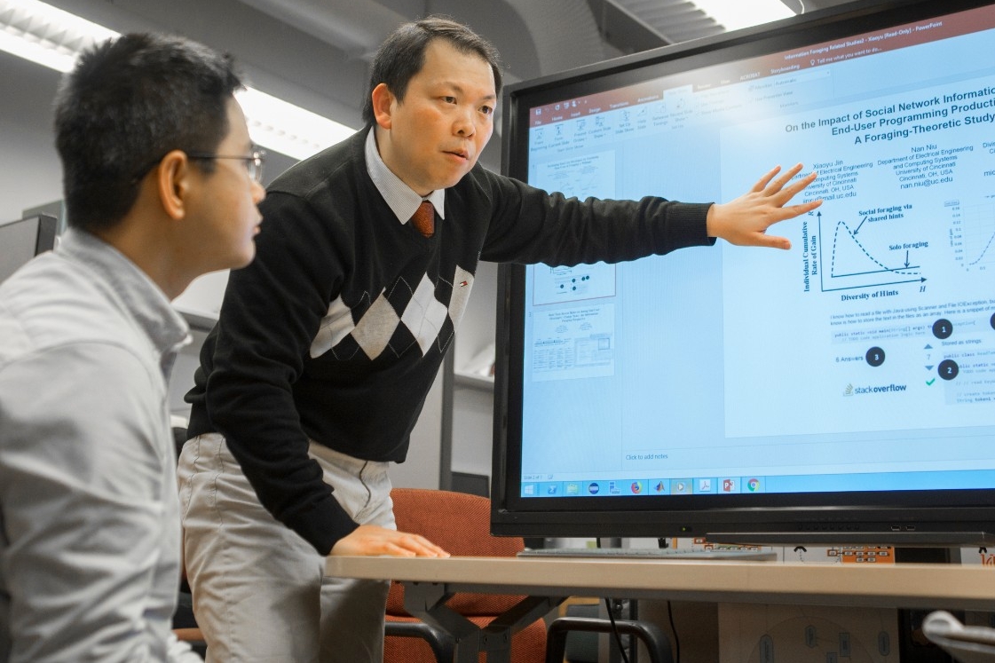 UC graduate student Xiaoyu Jin, left, and UC computer science professor Nan Niu found that software developers rarely found the code they needed all in one place.