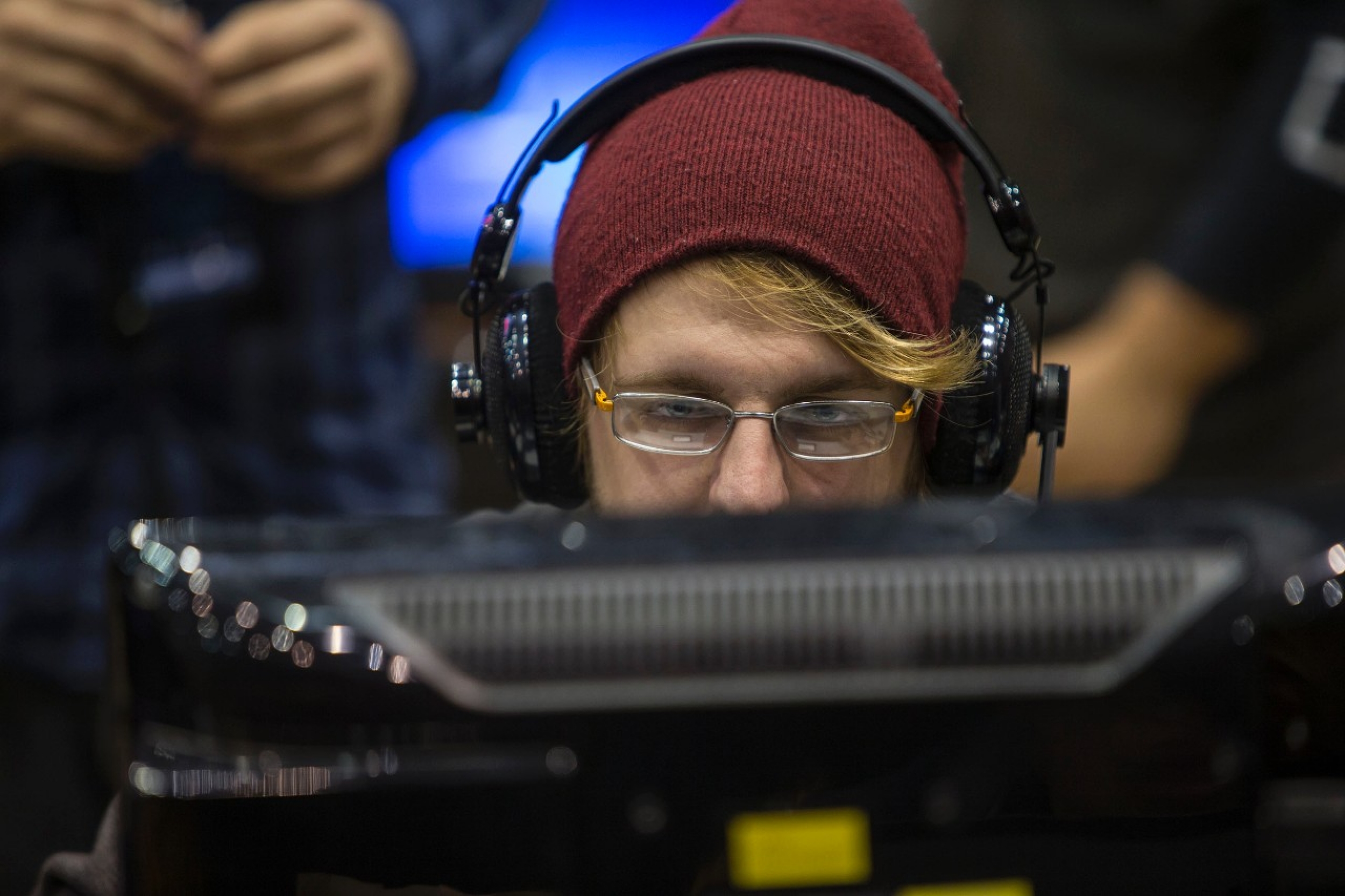 UC gamer stares at screen inside Fifth Third Arena