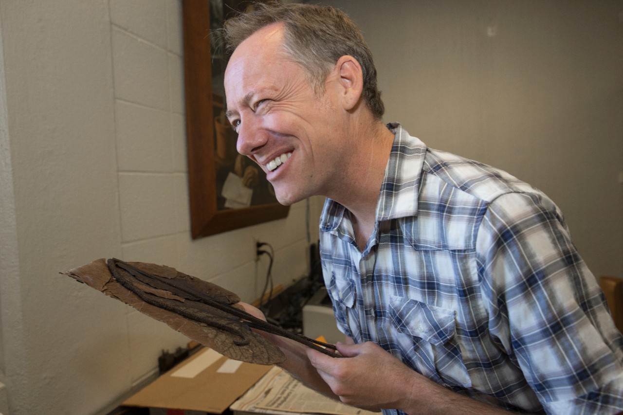 UC biology professor Eric Tepe reacts after smelling a pepper plant.