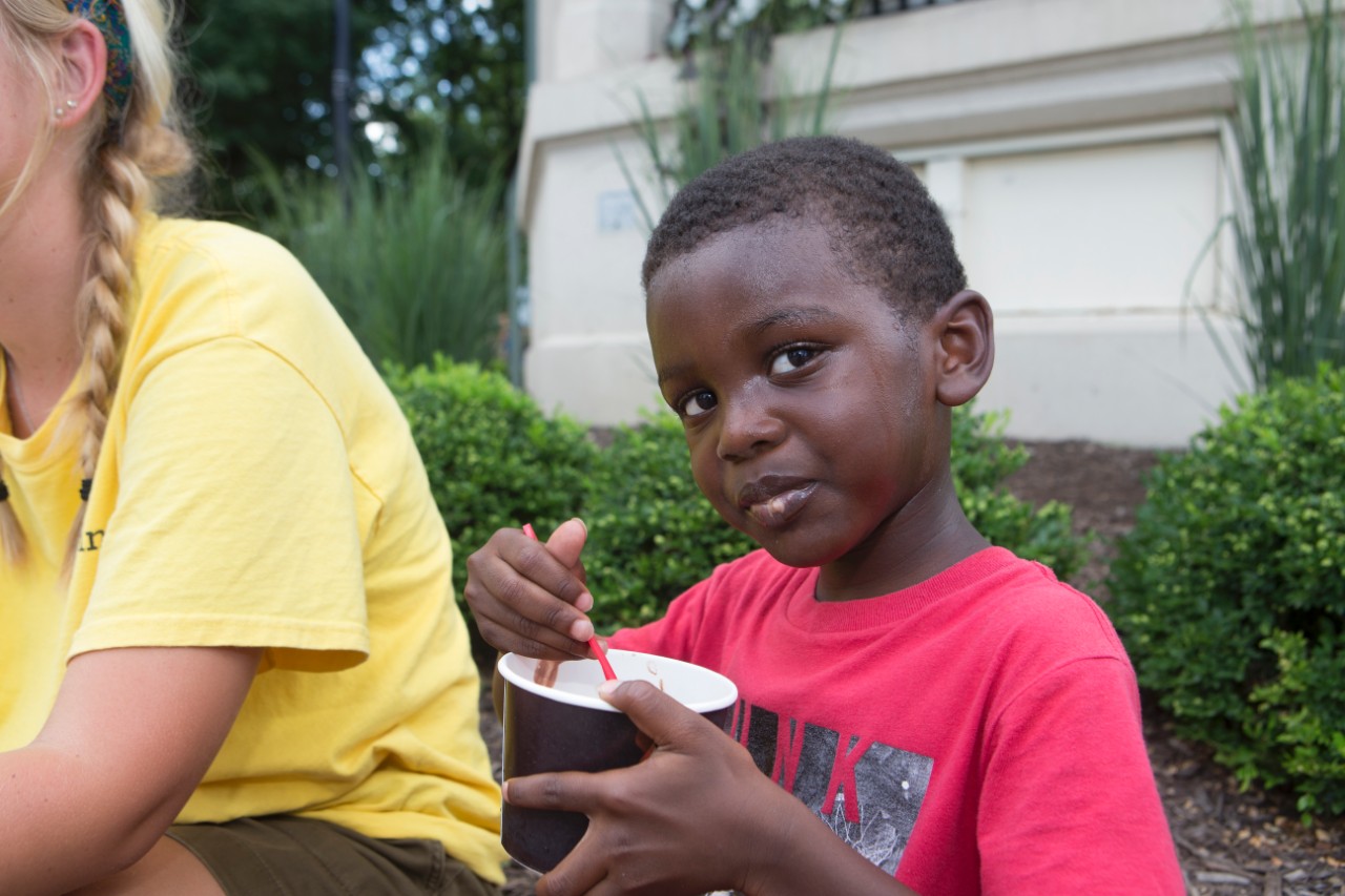 UpSpring summer camper enjoys the sun and fun at Washington Park. Photo/Joe Fuqua/UC Creative Services