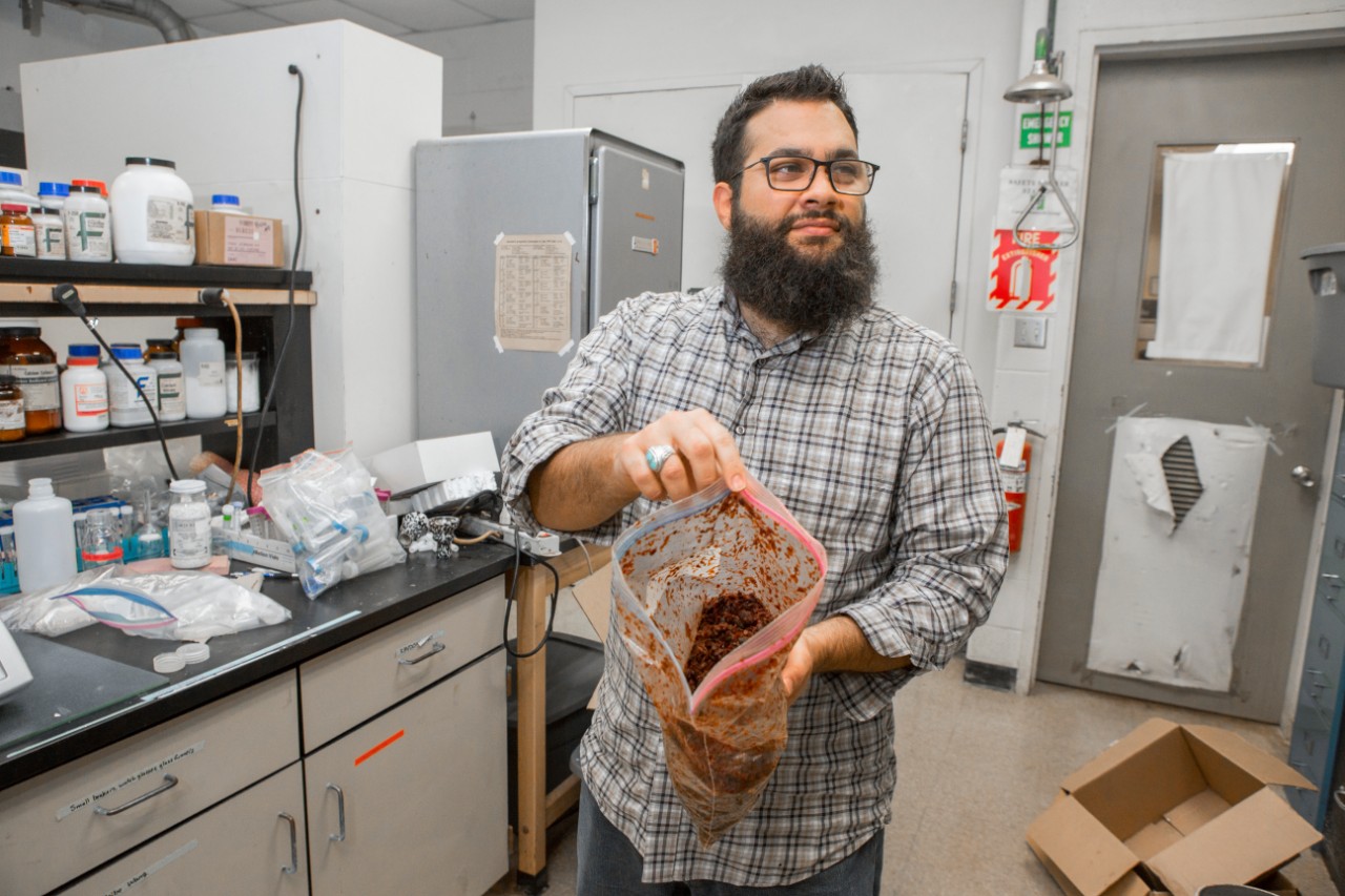 UC graduate student Ryan Saadawi shows a bag of hookah tobacco used in his chemistry study.
