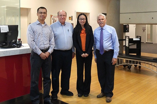 Bryan Weng, Tom White, Yu Mao and Dan Gotlieb stand for a picture