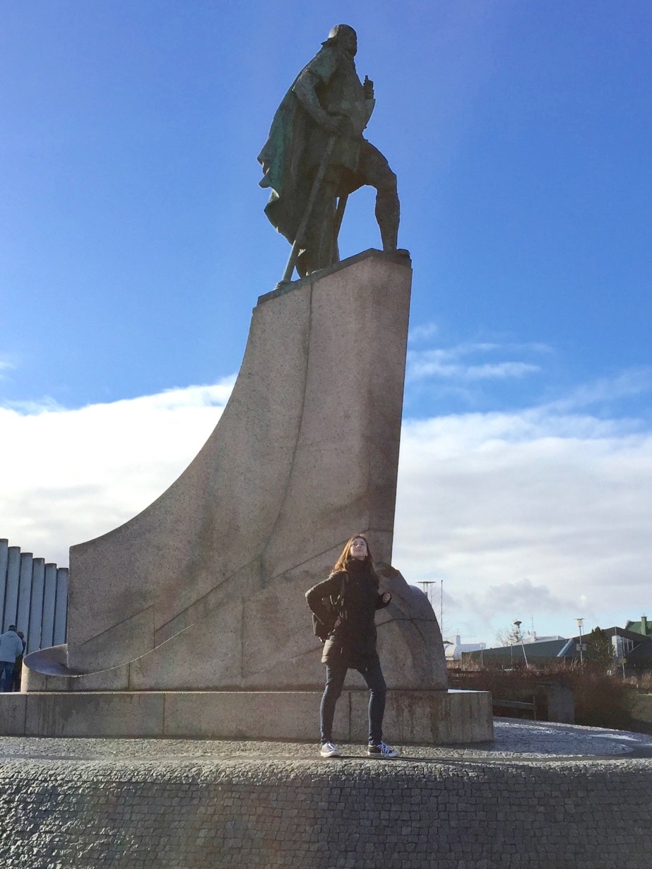 A woman stands if front of a statue of Leif Eriksson in Iceland.photo/Natalie Prager