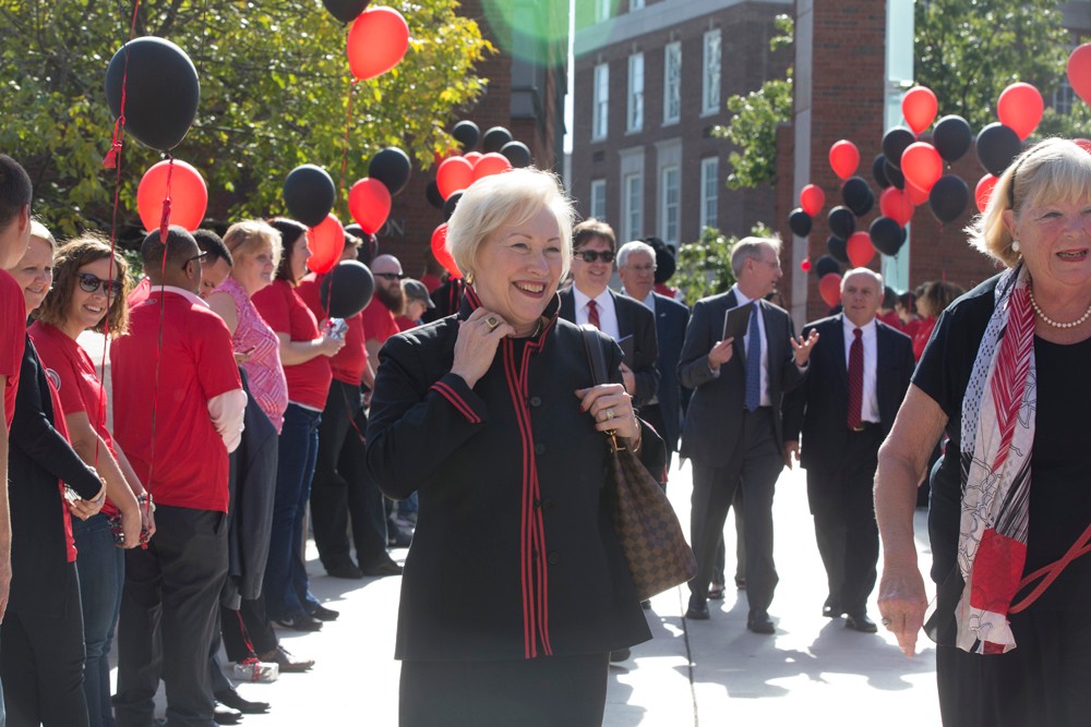 Former UC President Nancy Zimpher walks across campus after President Pinto's inauguration