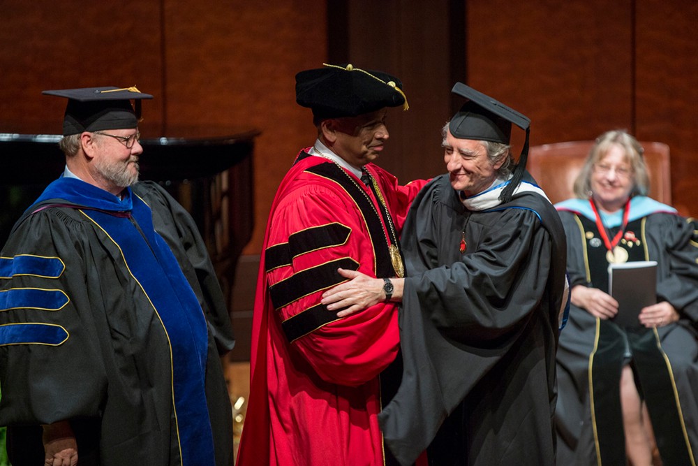 Neville Pinto shakes hands with DAAP Dean Robert Probst