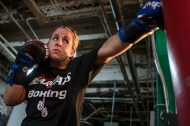 University of Cincinnati student and boxing champ Katie Harrington takes a stab at a boxing bag.