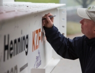 Dean signs final beam for new Lindner building