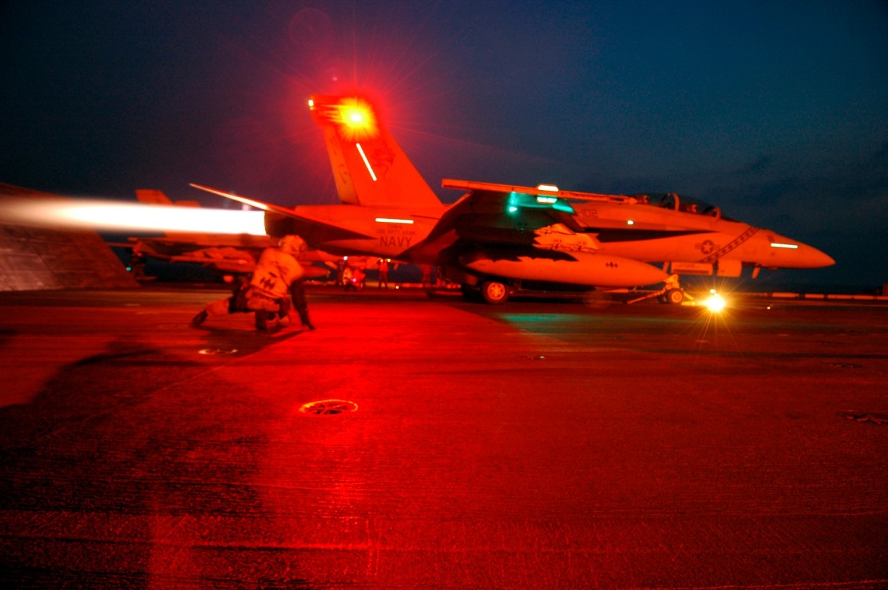 An F/A-18 Super Hornet takes off from the USS Kitty Hawk in 2005. UC professor Ephraim Gutmark helped the Navy design a quieter nozzle shape for this fighter plane. (U.S. Navy/Bo Flannigan)