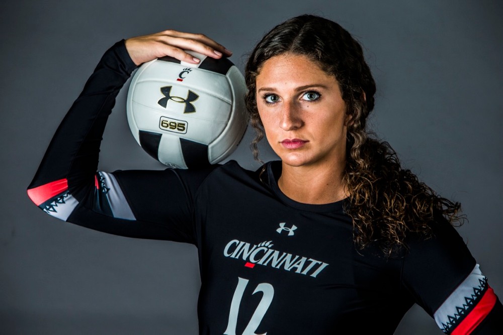 UC woman soccer player shows off her Under Armour gear.