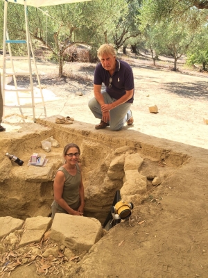 UC's Sharon Stocker, left, and Jack Davis, right, have worked in the Pylos region of Greece for 25 years. They led a team of 45 archaeologists and experts in various specialties as well as students during this summer's excavations. Stocker stands in the shaft tomb the team uncovered.
