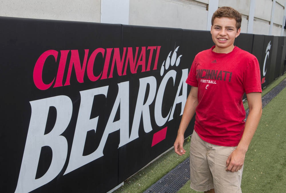 Mitch Stone, 18, stands on Sheakley Field before starting his first semester as a Bearcat this fall. Photo/Joe Fuqua/UC Creative Services