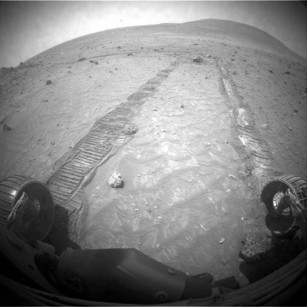 NASA's Spirit rover takes a photo showing its path across the Martian landscape on Sol 1806 or nearly three years into its mission. One of its wheels malfunctioned, apparent in the treadmarks. (NASA/JPL-Caltech)