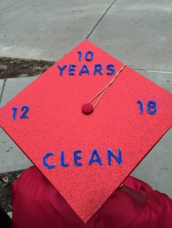 Cory Murphy's mortarboard proclaims 10 Years Clean