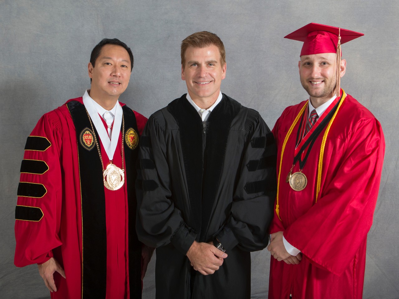  Murphy with UC President Santa Ono and commencement speaker Kirk Perry, Bus '90, HonDoc '15, president of brand solutions at Google.
