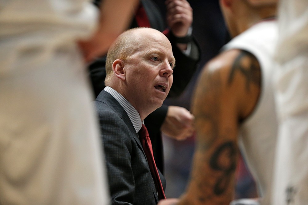 Coach Cronin talks to his players during a timeout. 