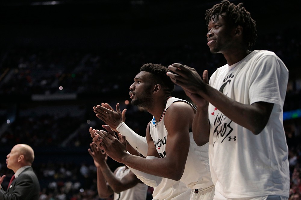 The Cincinnati bench cheers on their teammates. 