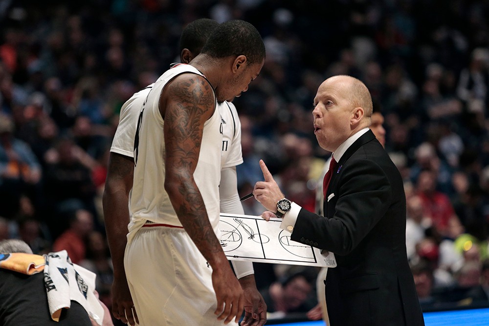 UC Coach Mick Cronin gives instructions to his players Friday during the Bearcats' first-round game against Georgia State.