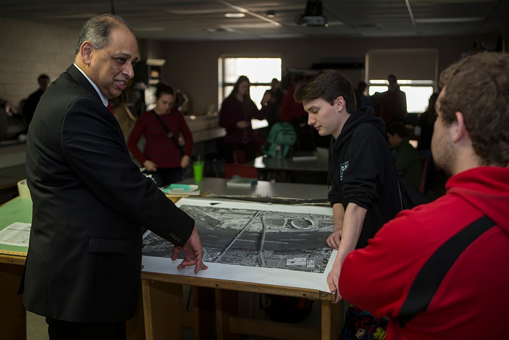 UC President Neville Pinto with high school students