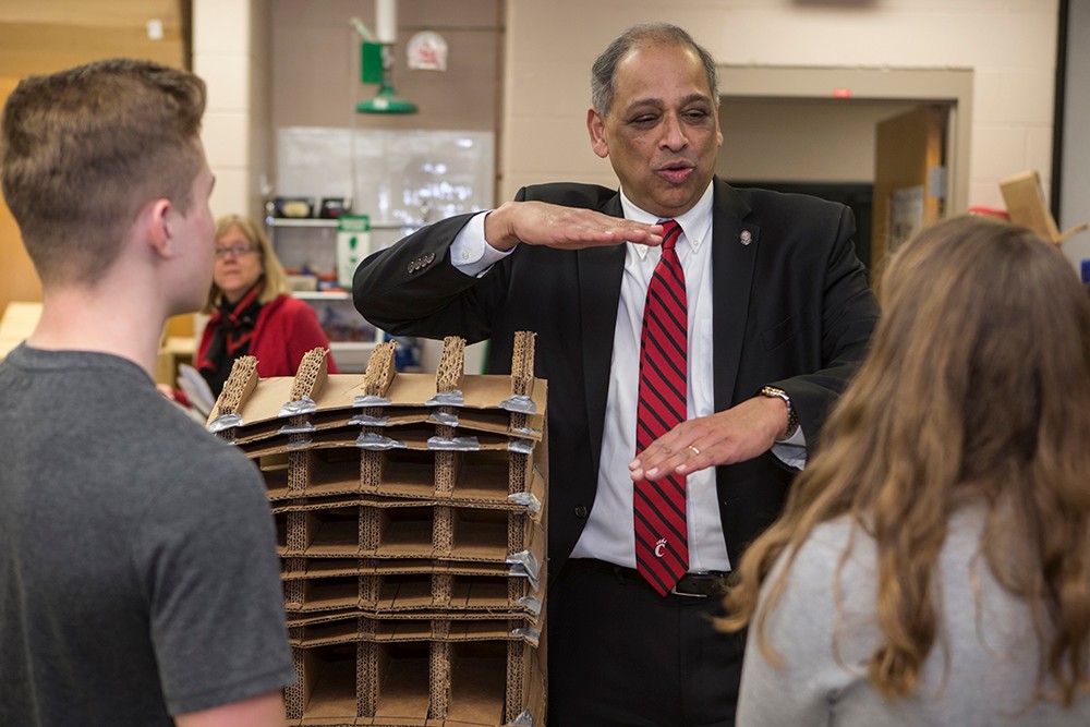 UC President Neville Pinto with high school students