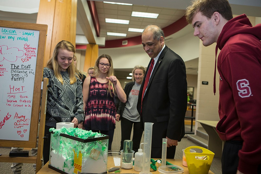 UC President Neville Pinto with high school students